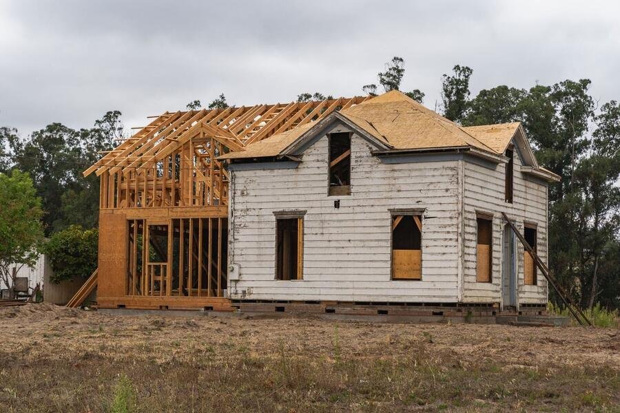 New timber-framed addition rising on a family home