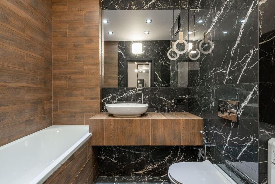Warm wood and black marble luxury bathroom