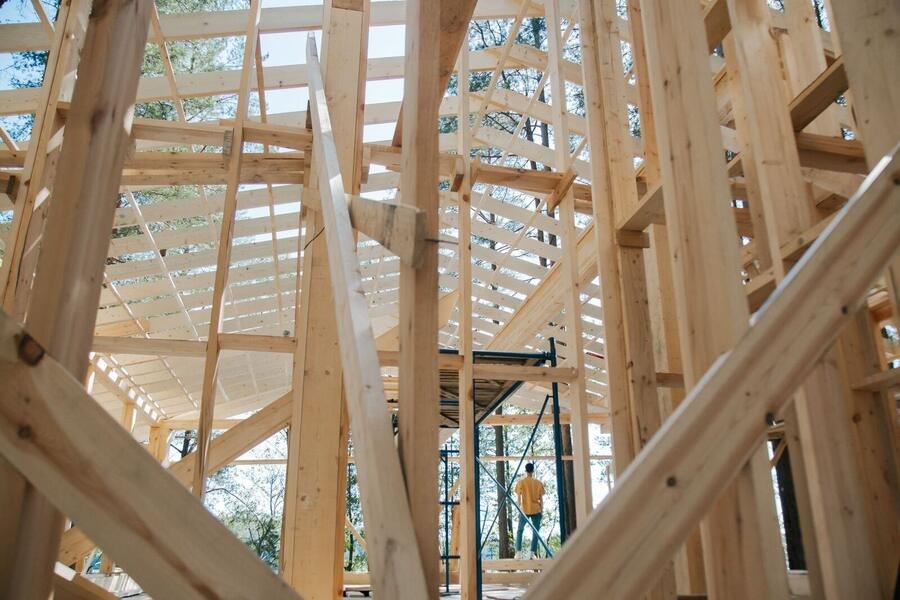 Detailed timber roof trusses under construction