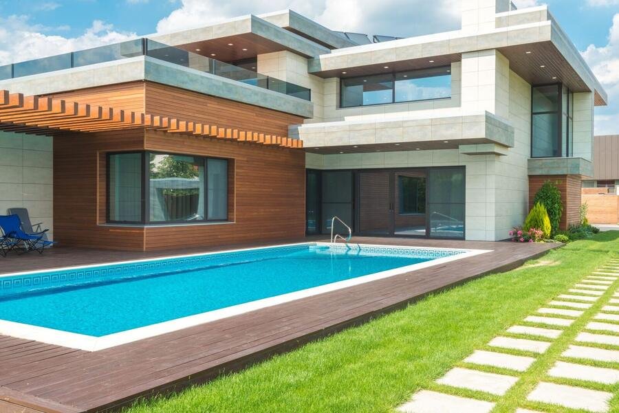 Custom home with pool and landscaped lawn