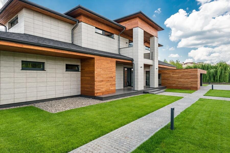 Modern two-storey house with cedar cladding and glass balcony