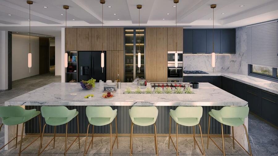 Large kitchen island with green seating beneath bright ceilings